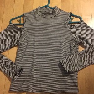 Women’s cold shoulder, high necked long sleeve.